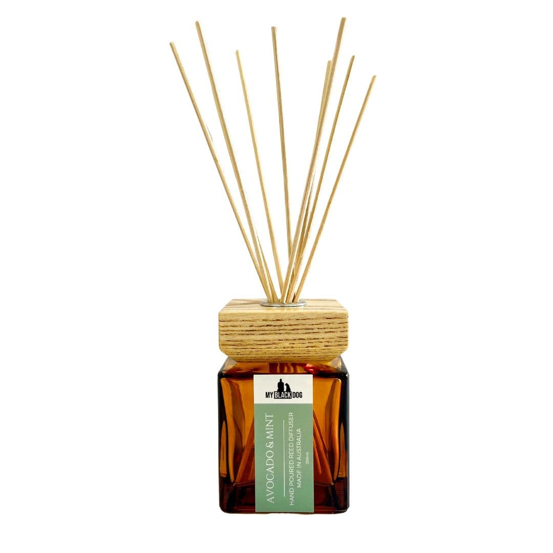 reed diffuser with wooden sticks on a white background
