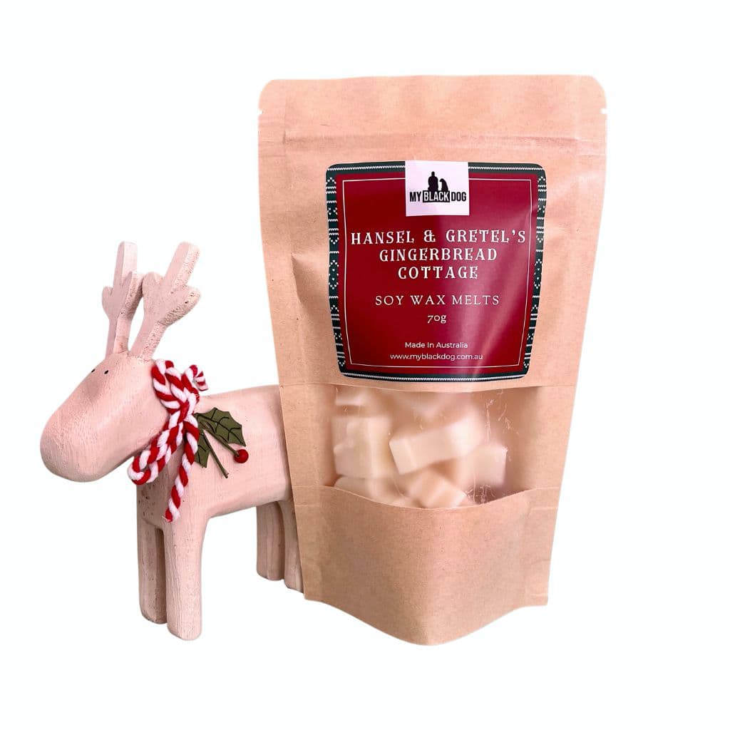 Hansel & Gretels Gingerbread Cottage Soy wax melts in a bag with a toy reindeer
