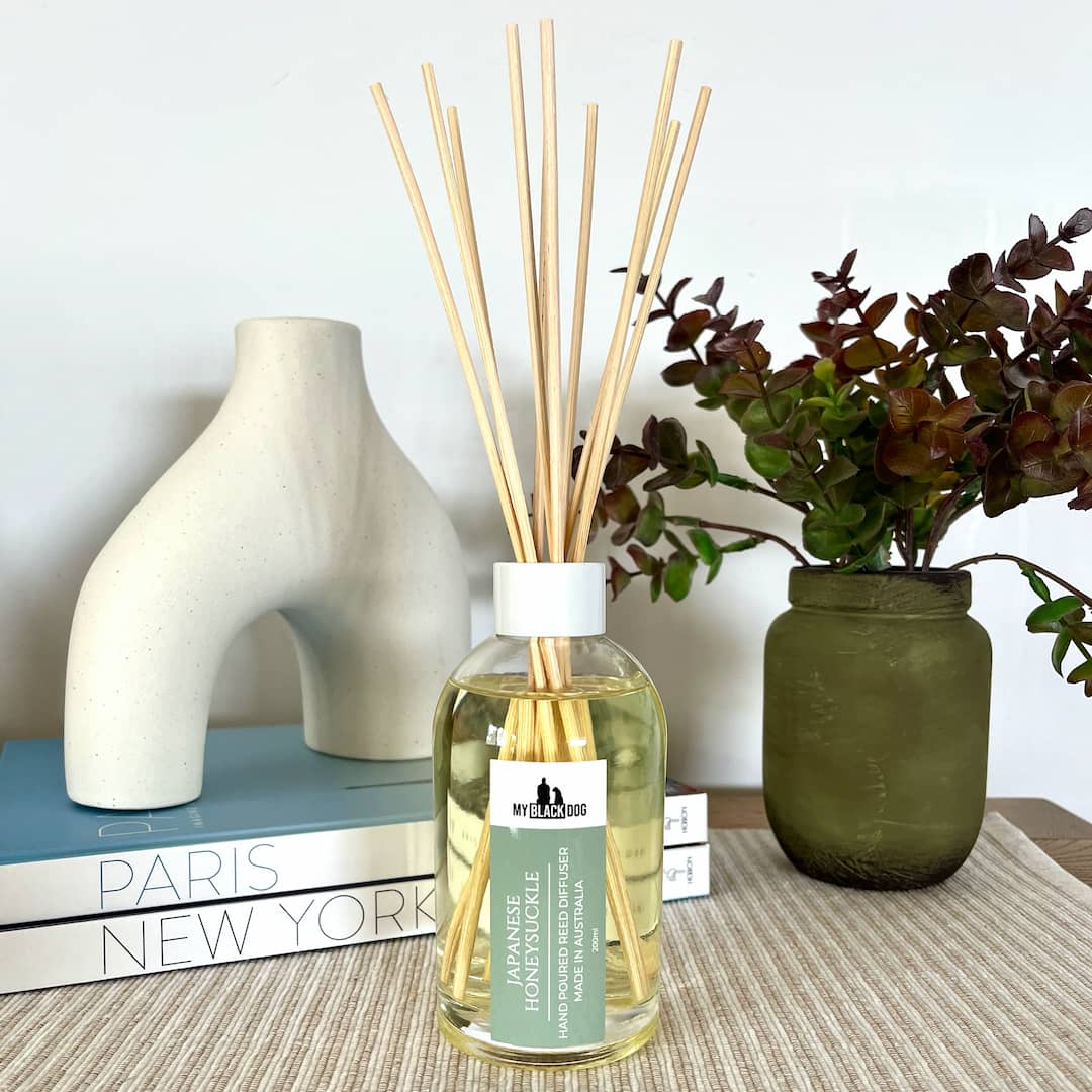 My Back Dog scented reed diffuser in a clear bottle with white lid.