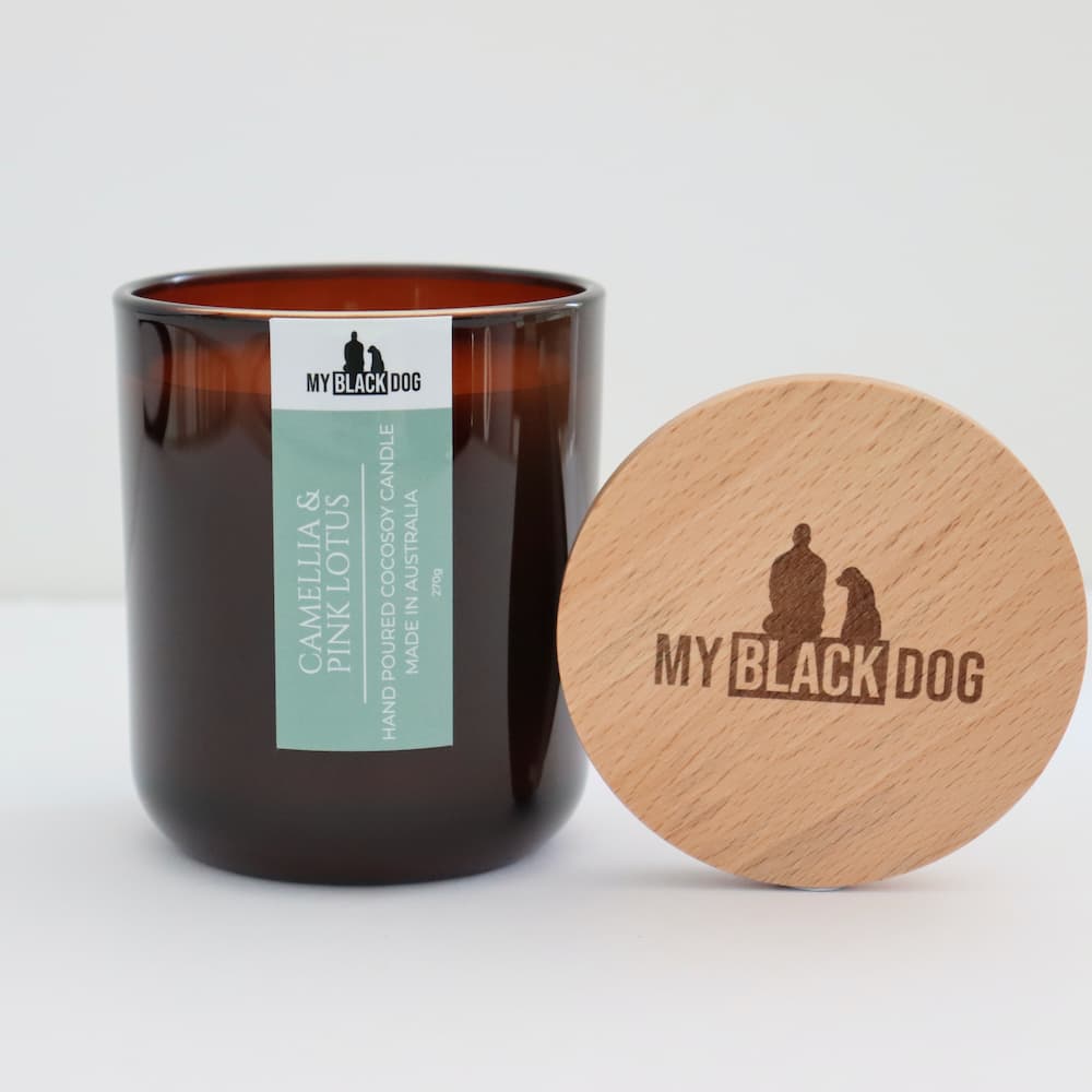 My Black Dog Camellia & Pink Lotus CocoSoy Scented Candle in an amber jar with timber lid