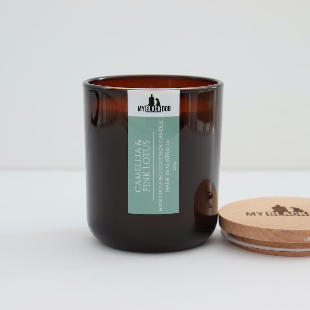 My Black Dog Camellia & Pink Lotus CocoSoy Scented Candle in an amber jar with timber lid