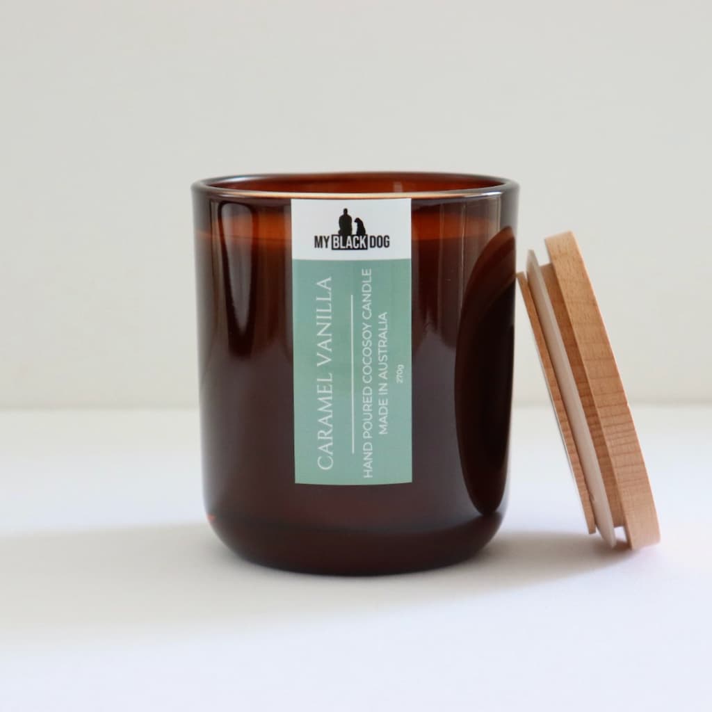My Black Dog Caramel Vanilla CocoSoy Candle in an amber jar with timber lid