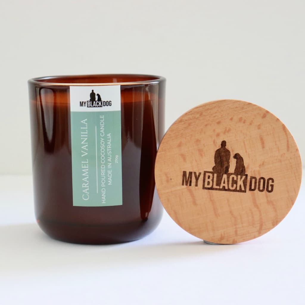 My Black Dog Caramel Vanilla CocoSoy Candle in an amber jar with timber lid