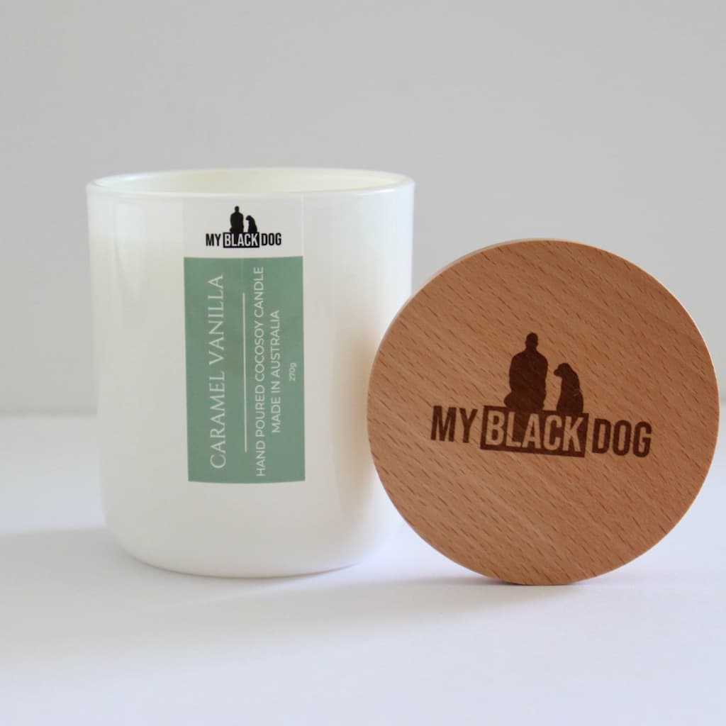 My Black Dog Caramel Vanilla CocoSoy Candle in a white jar with timber lid