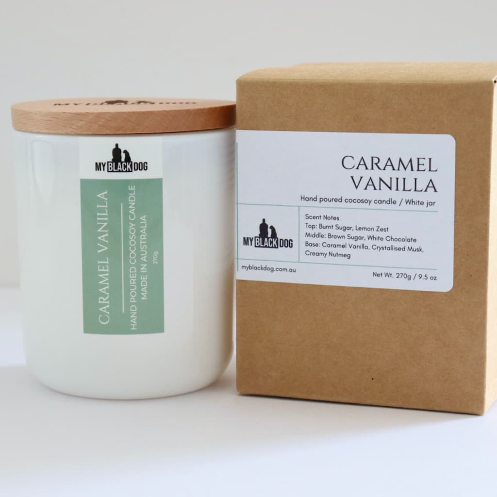 My Black Dog Caramel Vanilla CocoSoy Candle in a white jar with timber lid and box