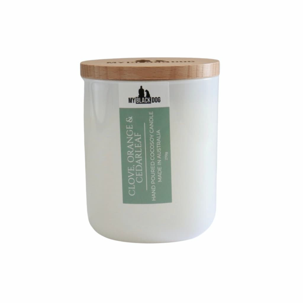My Black Dog Clove, Orange & Cedarleaf CocoSoy Candle in a white jar with timber lid