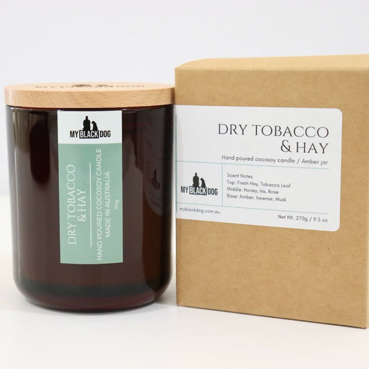 My Black Dog Dry Tobacco & Hay CocoSoy Candle in an amber jar with a natural timber lid and box
