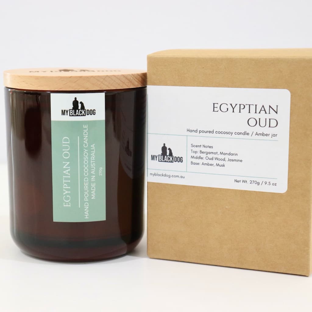 My Black Dog Egyptian Oud CocoSoy Candle in an amber jar with a natural timber lid with a box