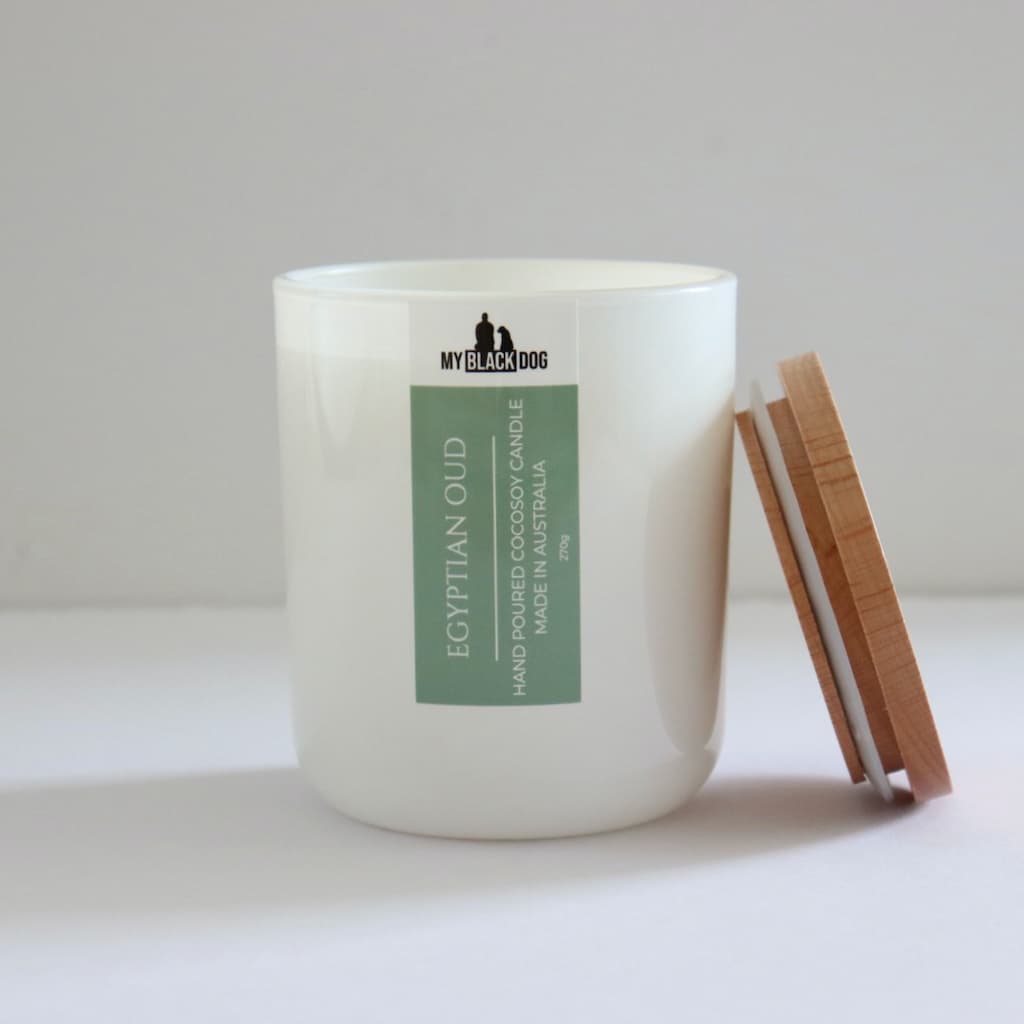My Black Dog Egyptian Oud CocoSoy Candle in a white jar with timber lid