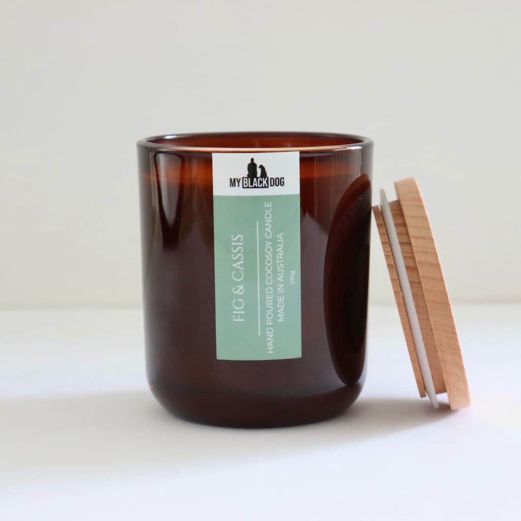 My Black Dog Fig & Cassis CocoSoy Candle in an amber jar with natural timber lid