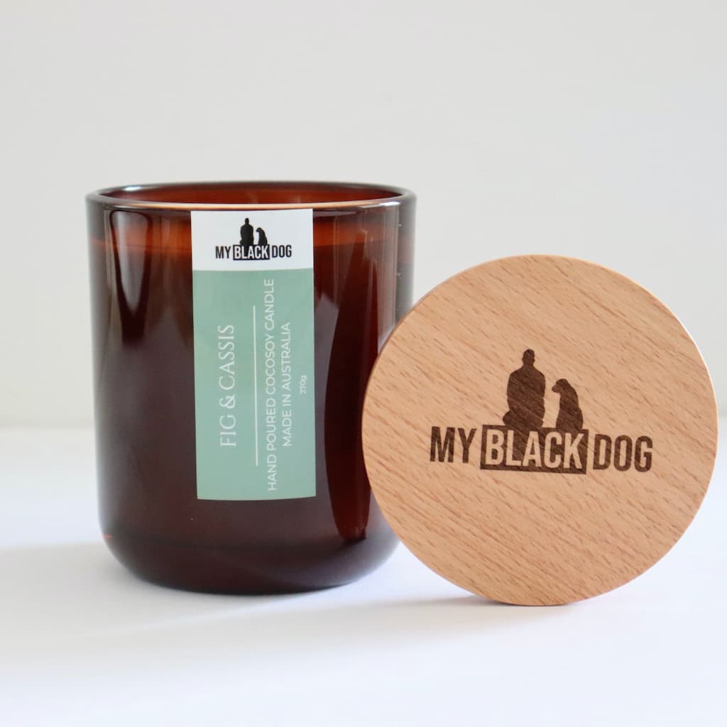 My Black Dog Fig & Cassis CocoSoy Candle in an amber jar with natural timber lid
