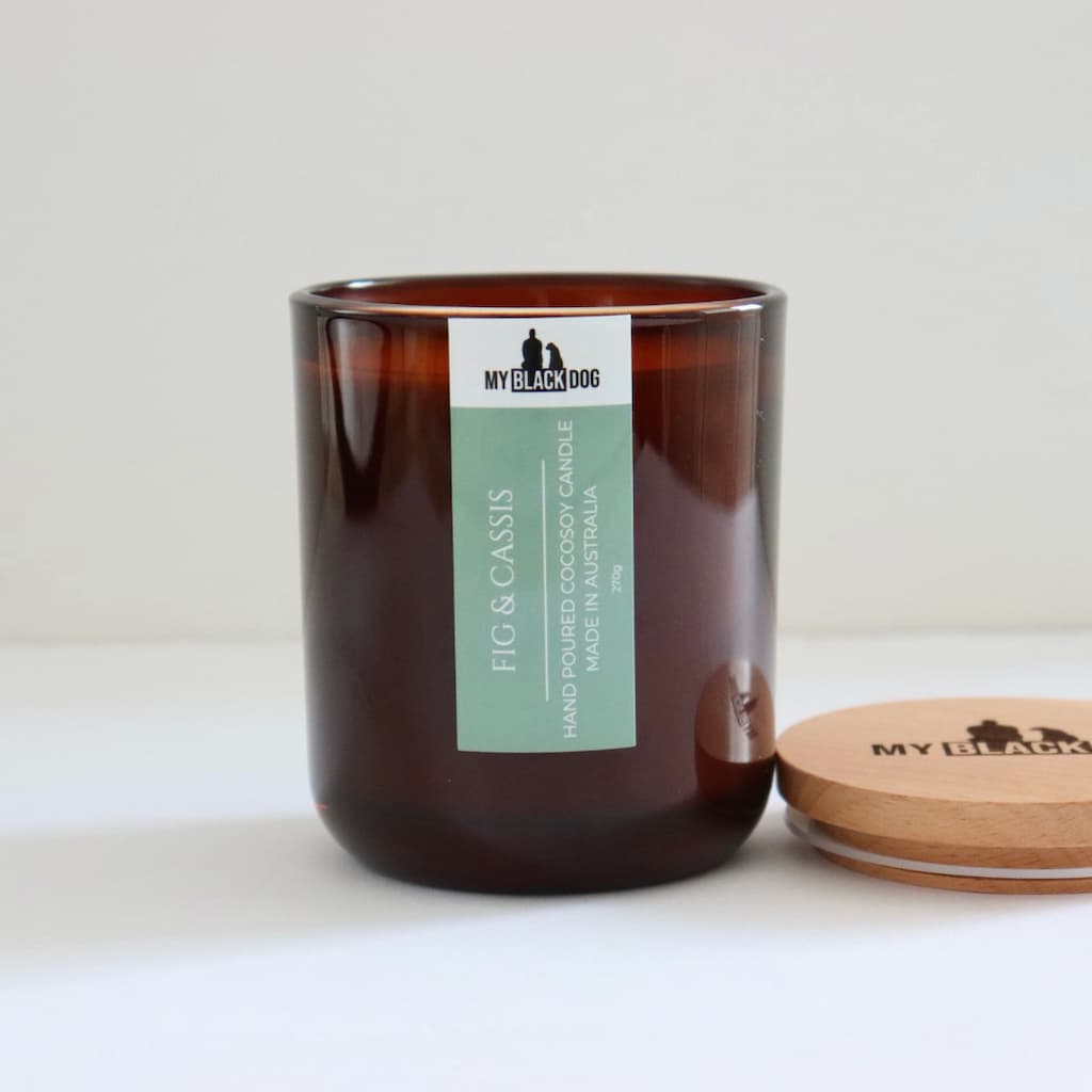My Black Dog Fig & Cassis CocoSoy Candle in an amber jar with natural timber lid