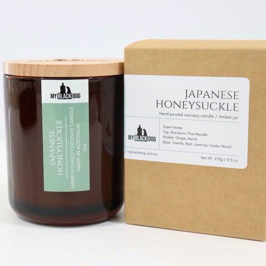 My Black Dog Japanese Honeysuckle CocoSoy Candle in an amber jar with a natural timber lid and a box