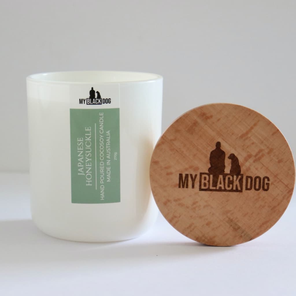 My Black Dog Japanese Honeysuckle CocoSoy Candle in a white jar with timber lid