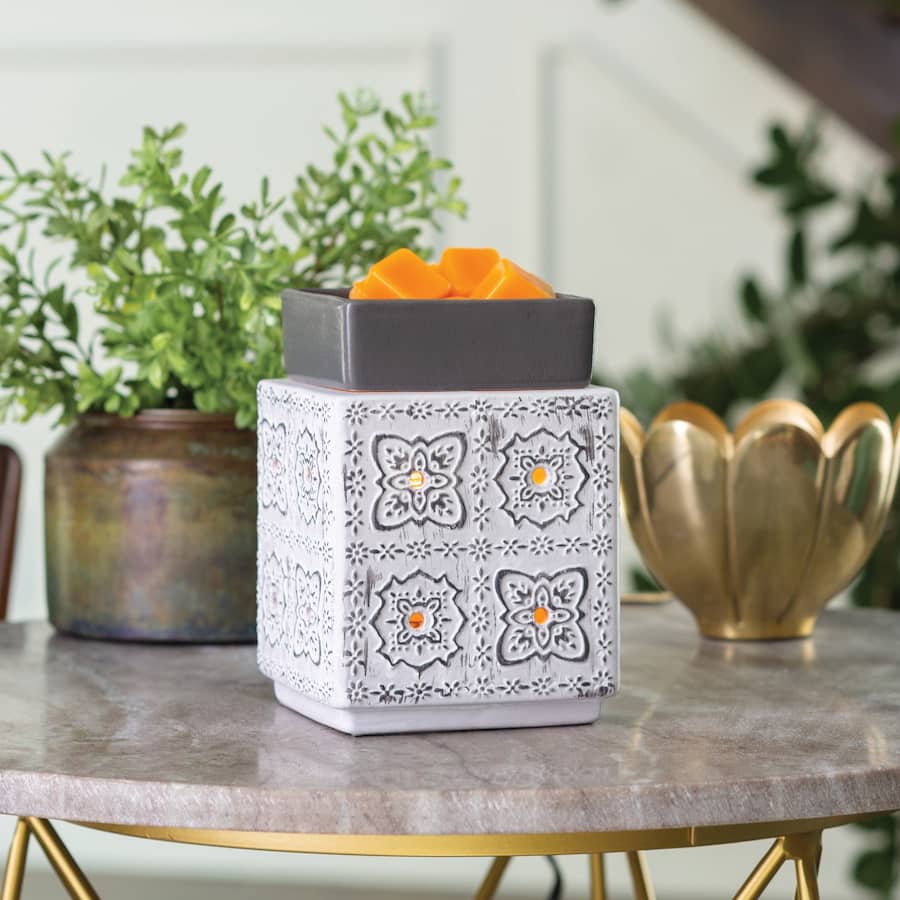 Modern Cottage Illumination Wax Melt Warmer sitting on coffee table