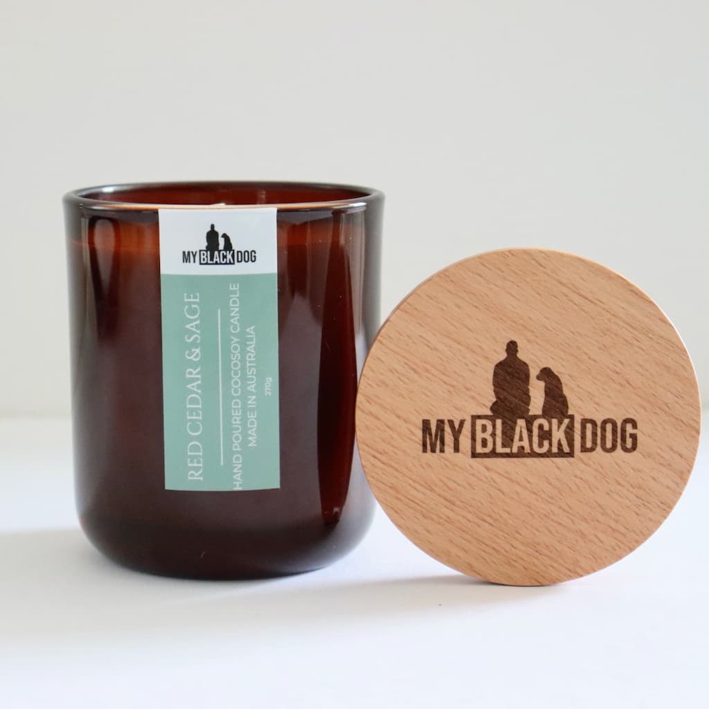 My Black Dog Red Cedar & Sage CocoSoy Candle in amber jar with a natural timber lid