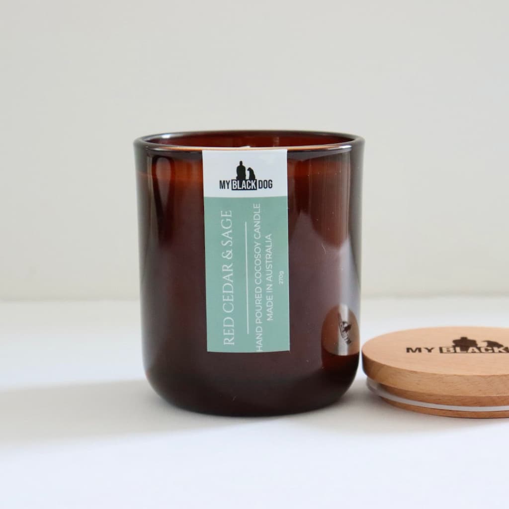 My Black Dog Red Cedar & Sage CocoSoy Candle in amber jar with a natural timber lid