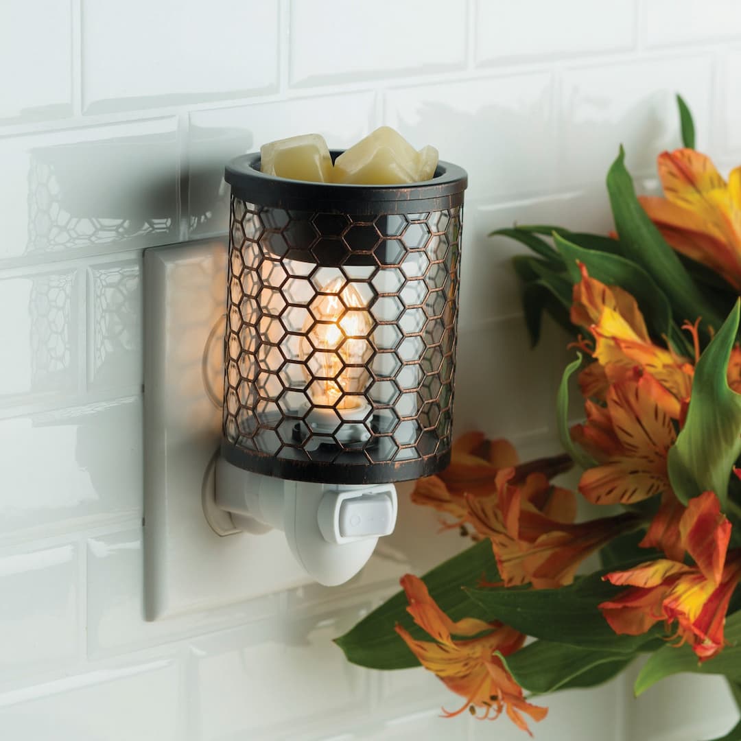 Chicken Wire Pluggable Wax Melt Warmer plugged into a wall outlet