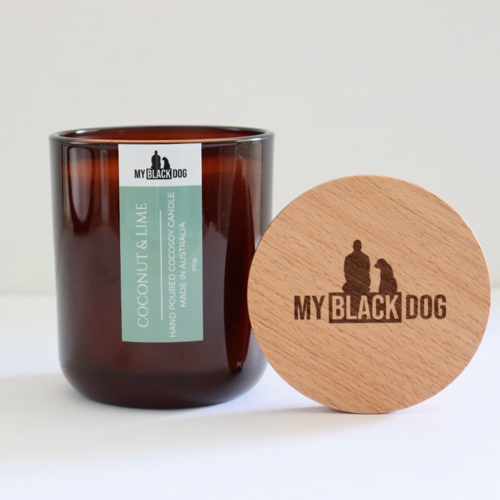 My Black Dog Coconut & Lime CocoSoy Candle in an amber jar with a natural lid