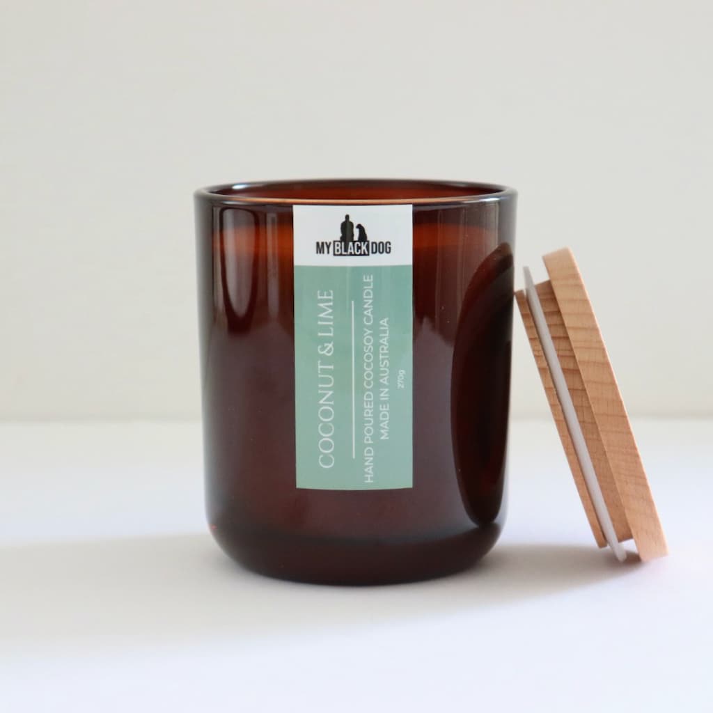 My Black Dog Coconut & Lime CocoSoy Candle in an amber jar with a natural lid