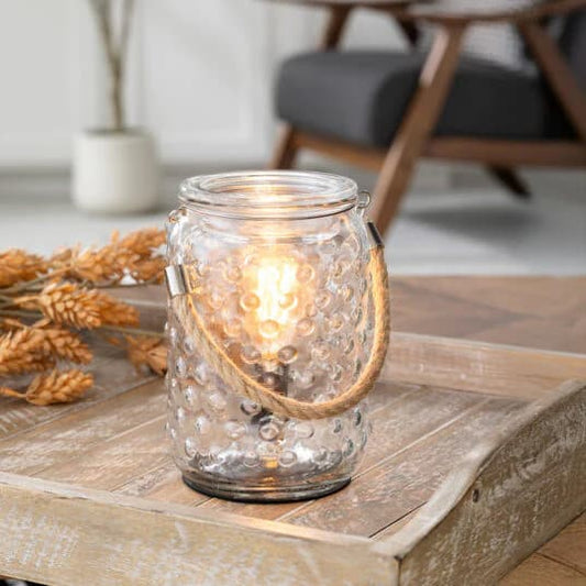 Hobnail & Rope Illumination Wax Melt Warmer sitting on a wooden tray 