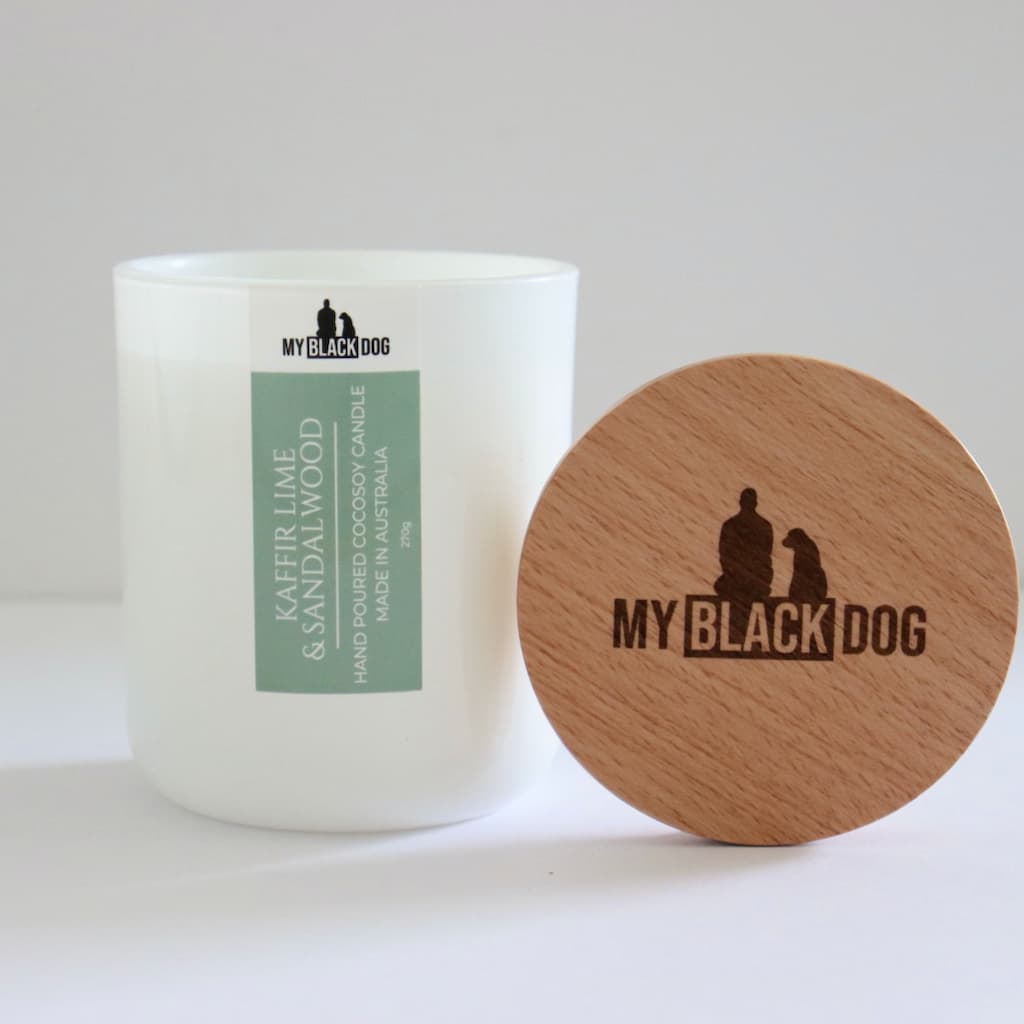 My Black Dog Kaffir Lime & Sandalwood CocoSoy Candle in a white jar with natural timber lid