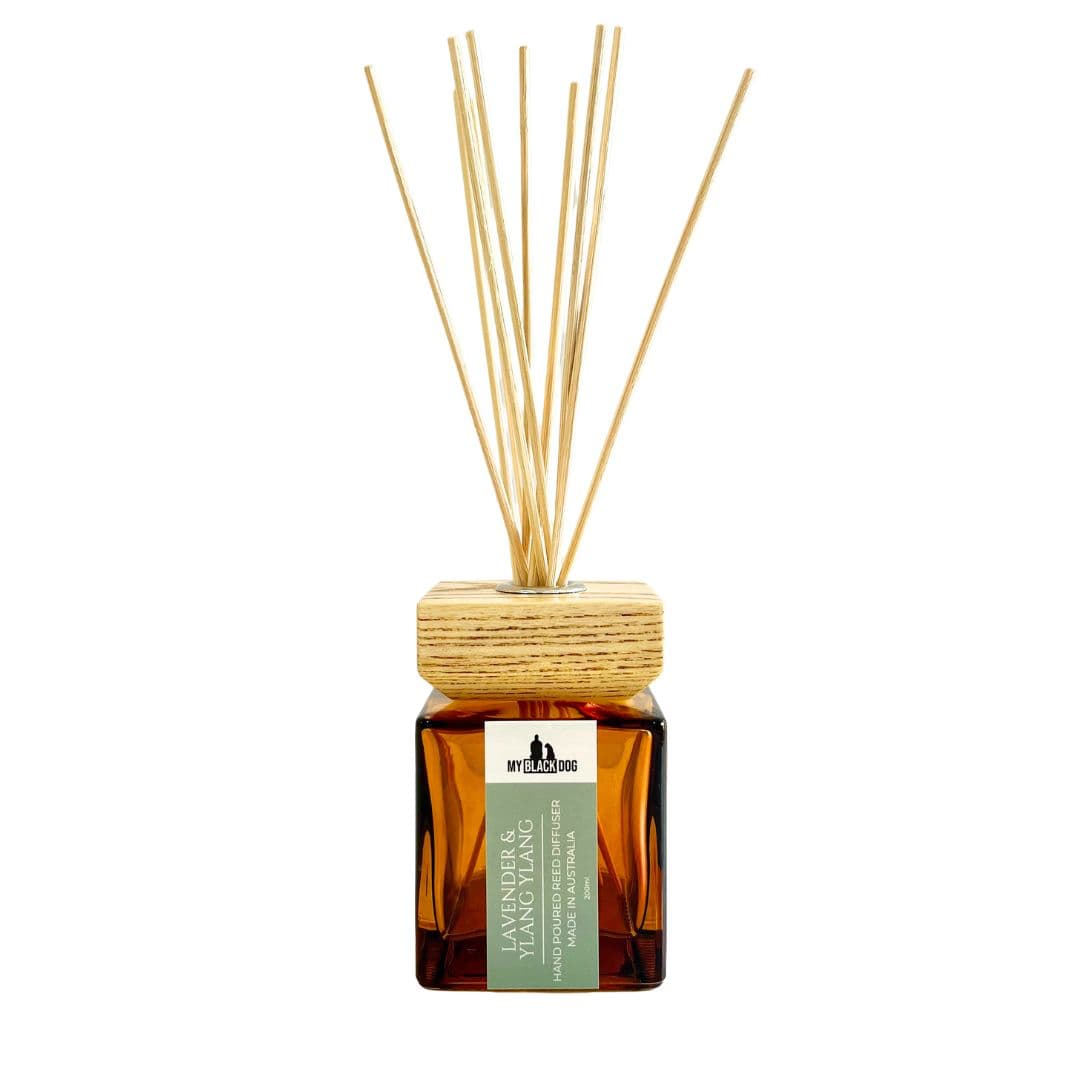 My Black Dog lavender and ylang ylang scented reed diffuser in a square amber bottle with wood lid, on a white background.