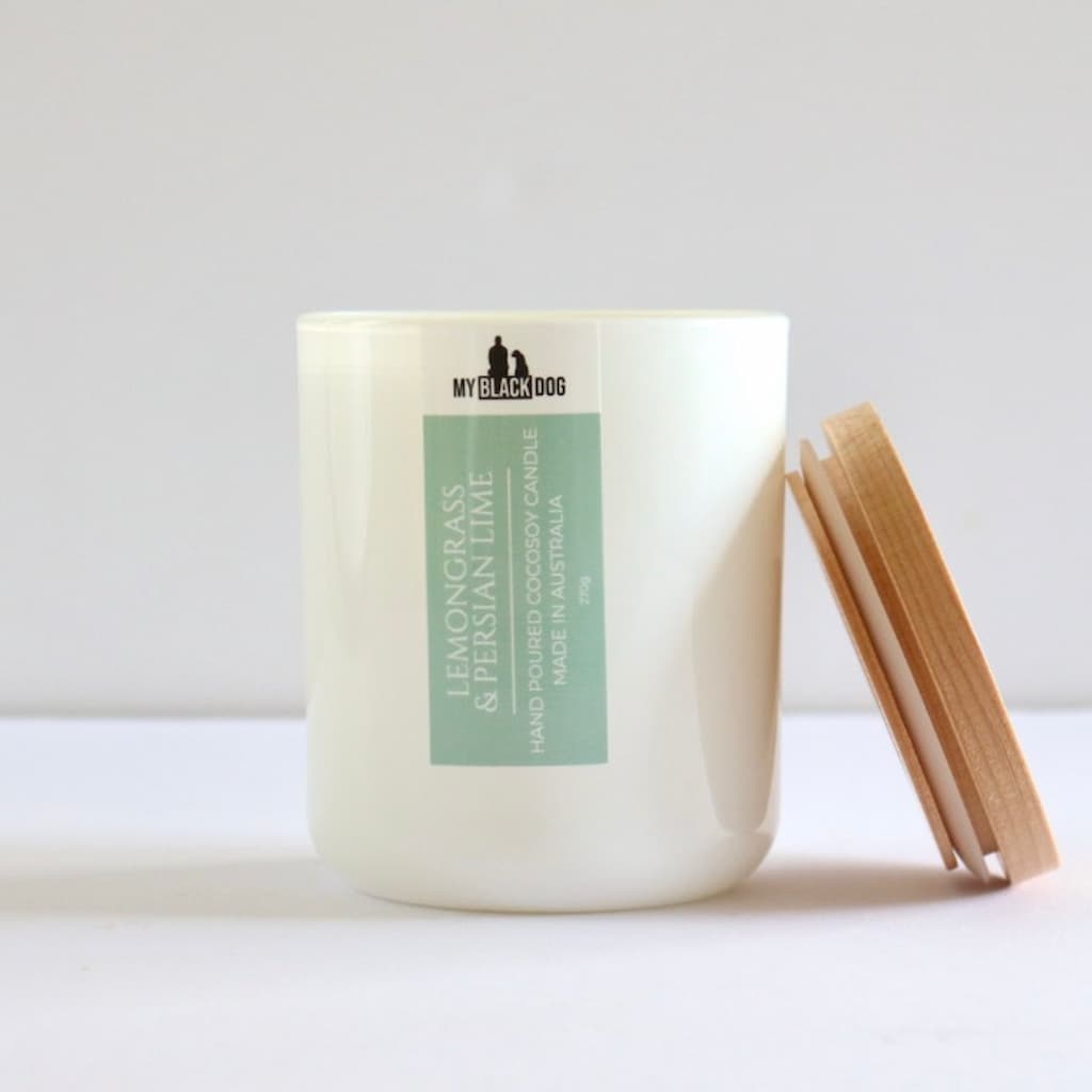 My Black Dog Lemongrass & Persian Lime CocoSoy Candle in a white jar with wooden lid