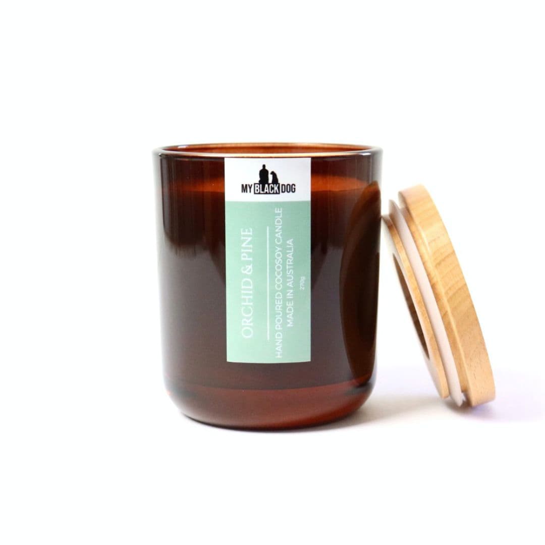 My Black Dog Orchid & Pine CocoSoy Candle in an amber jar with timber lid