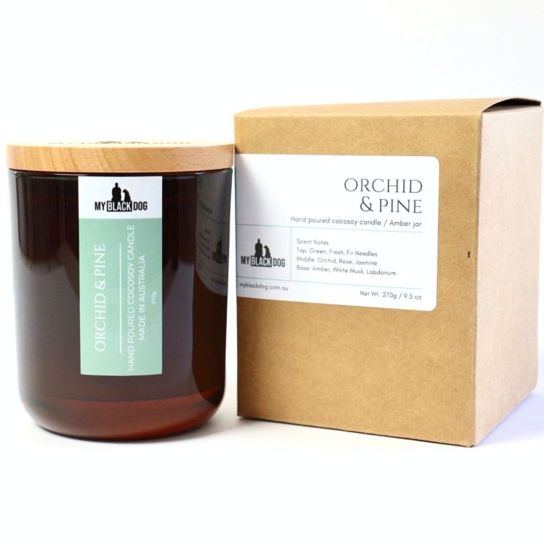 My Black Dog Orchid & Pine CocoSoy Candle in an amber jar with a box