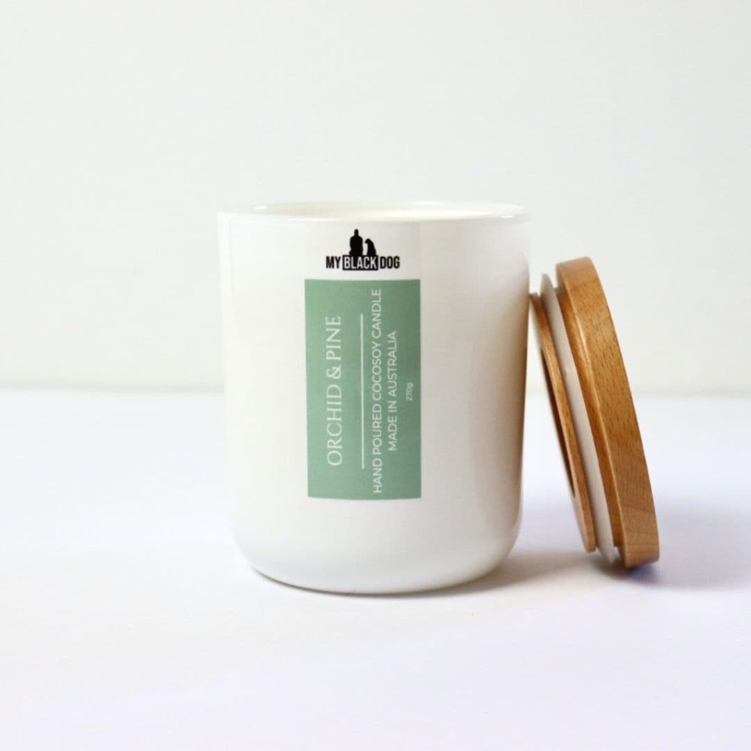 My Black Dog Orchid & Pine CocoSoy Candle in a white jar with a timber lid