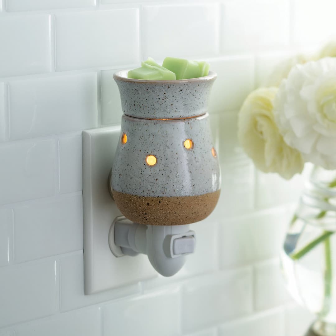 Rustic White Pluggable Melt Warmer in a wall socket