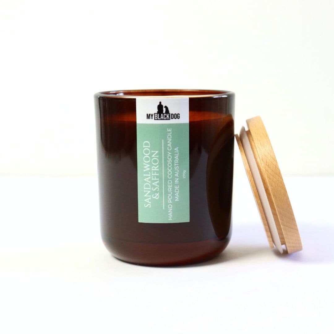 My Black Dog Sandalwood & Saffron CocoSoy Candle in an amber jar with timber lid