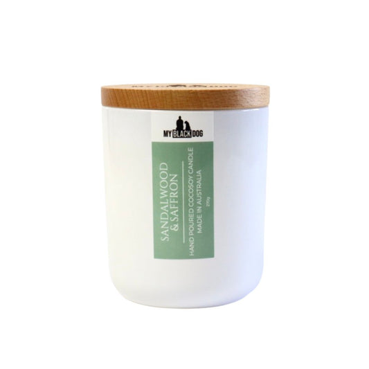 My Black Dog Sandalwood & Saffron CocoSoy Candle in a white jar with a timber lid