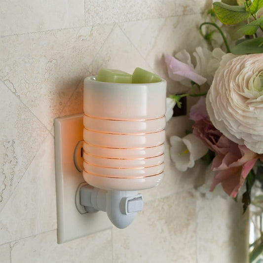 Serenity Pluggable Wax Melt Warmer plugged into wall