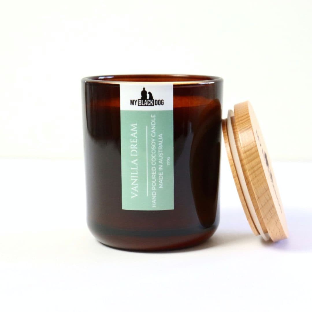 My Black Dog Vanilla Dream CocoSoy Candle in an amber jar with a timber lid