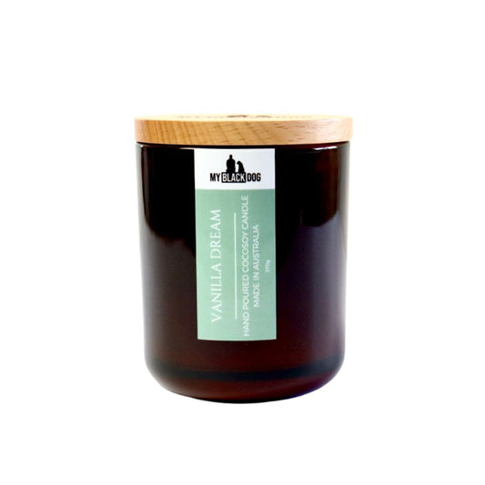 My Black Dog Vanilla Dream CocoSoy Candle in an amber jar with timber lid