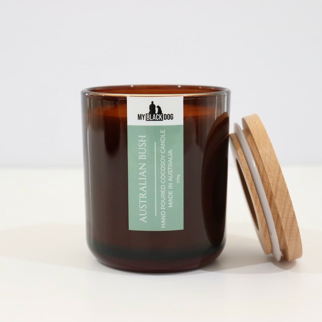 My Black Dog Australian Bush CocoSoy Candle in an amber jar with a natural timber lid