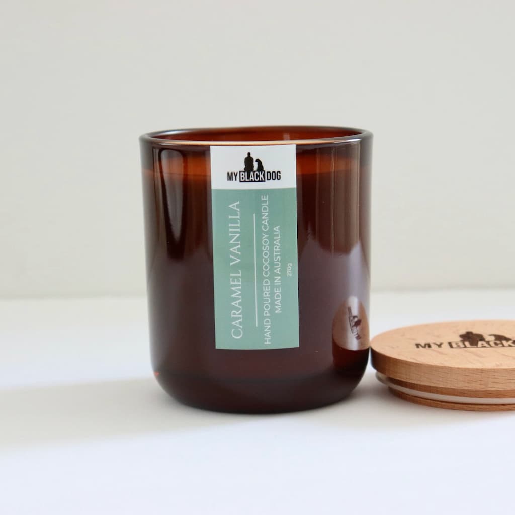 My Black Dog Caramel Vanilla CocoSoy Candle in an amber jar with timber lid