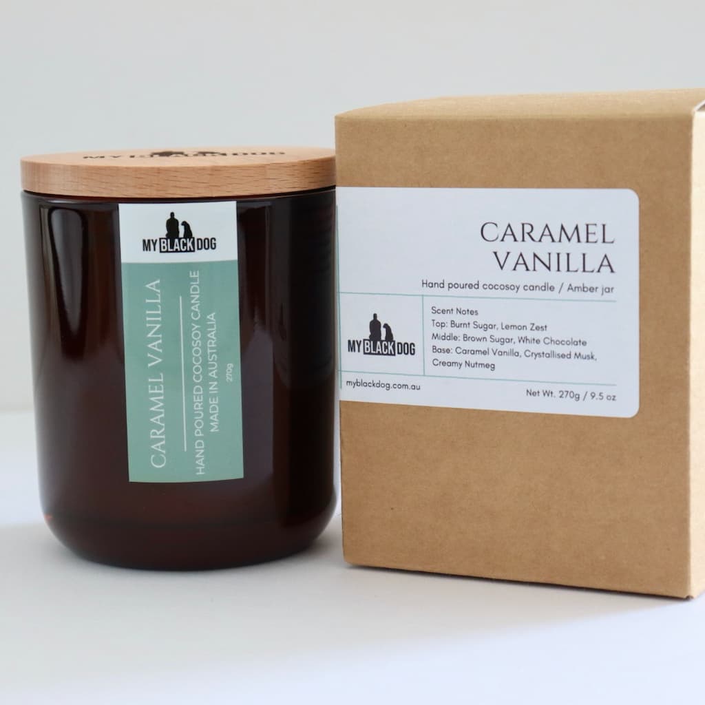 My Black Dog Caramel Vanilla CocoSoy Candle in an amber jar with timber lid and box