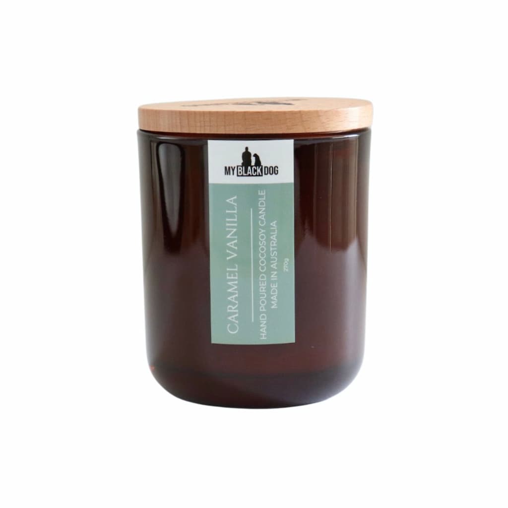 My Black Dog Caramel Vanilla CocoSoy Candle in an amber jar with timber lid