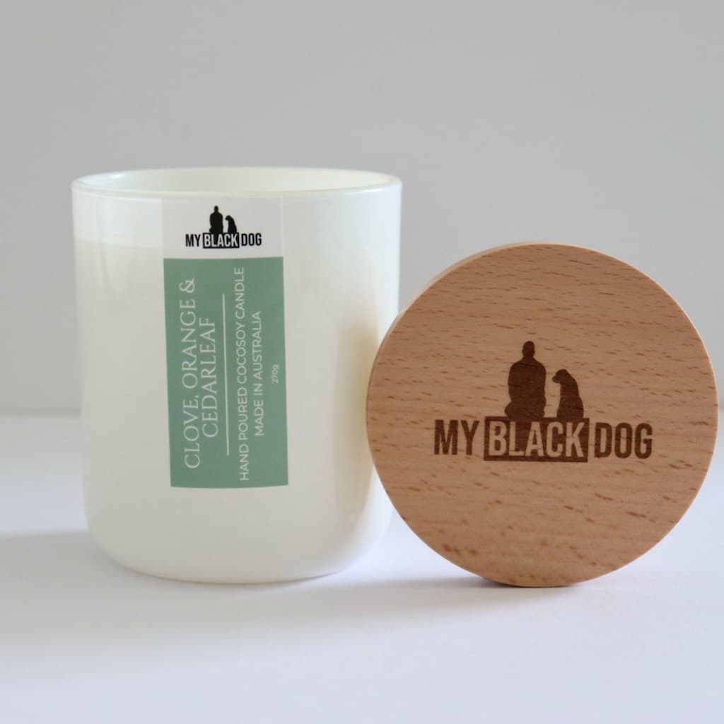 My Black Dog Clove, Orange & Cedarleaf CocoSoy Candle in a white jar with timber lid