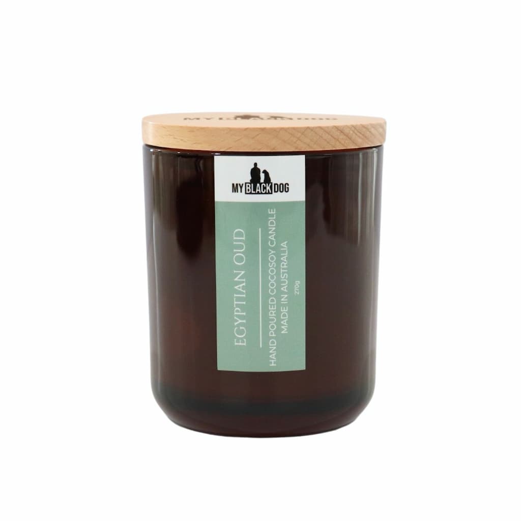 My Black Dog Egyptian Oud CocoSoy Candle in an amber jar with a natural timber lid