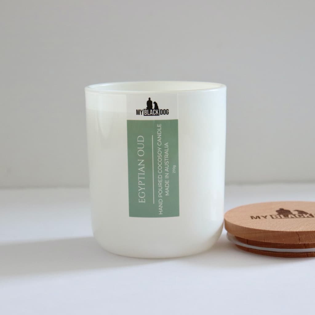 My Black Dog Egyptian Oud CocoSoy Candle in a white jar with timber lid