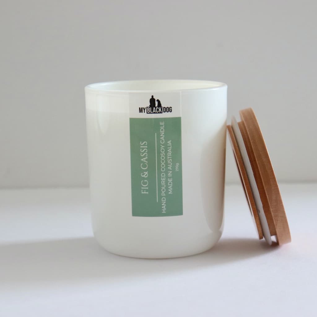 My Black Dog Fig & Cassis CocoSoy Candle in a white jar with timber lid
