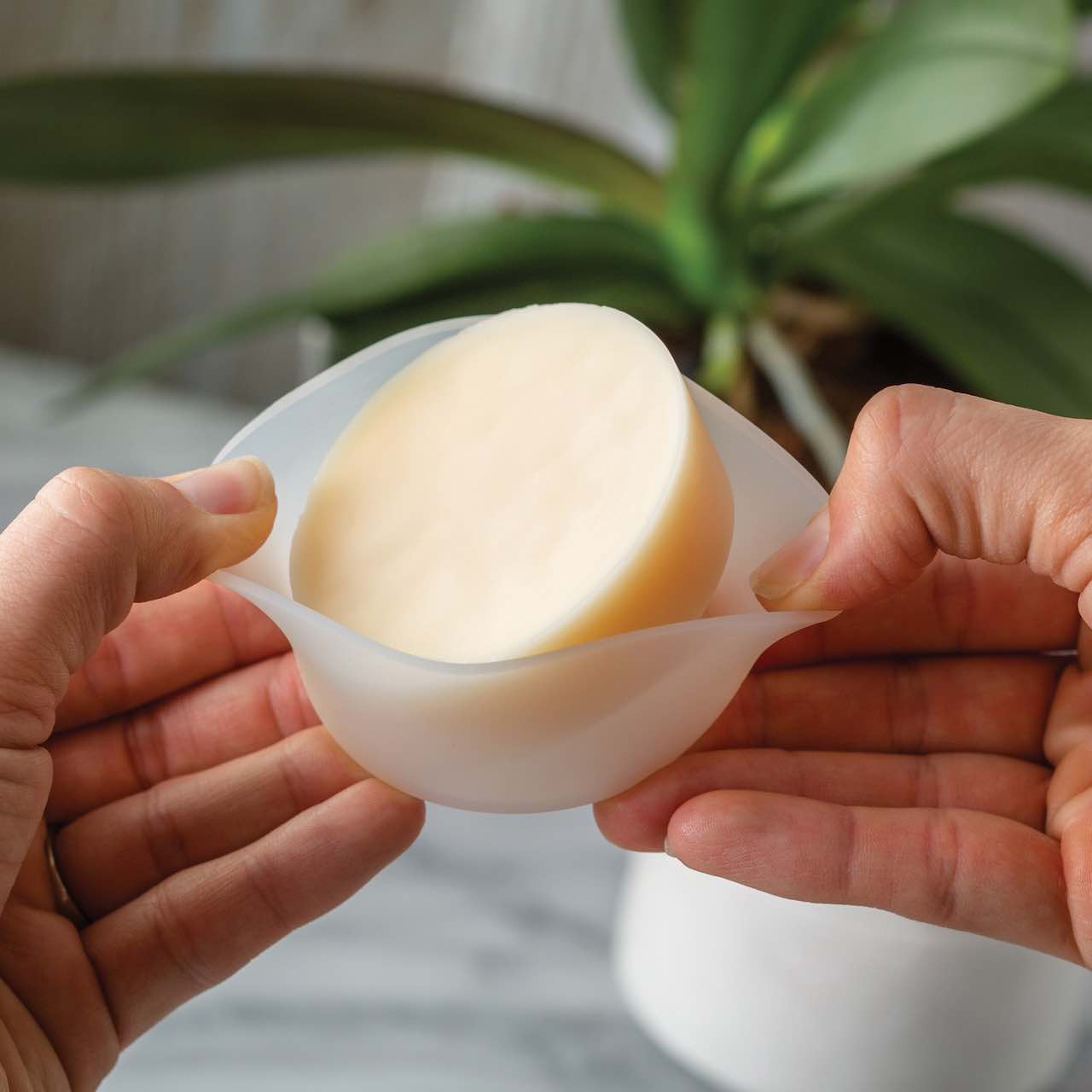 Wax being removed from a Wax Melt Silicone Flip dish