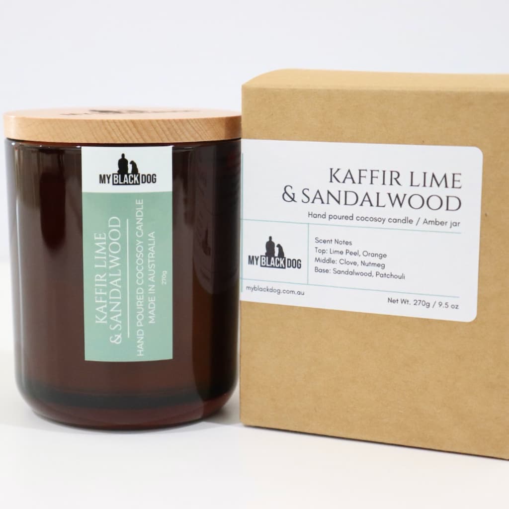 My Black Dog Kaffir Lime & Sandalwood CocoSoy Candle in an amber jar with a natural timber lid and a box