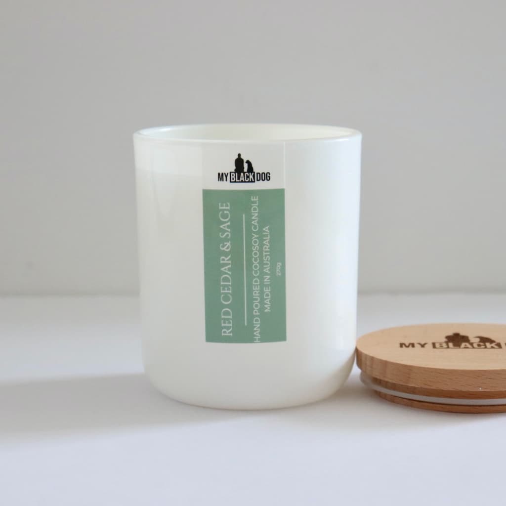 My Black Dog Red Cedar & Sage CocoSoy Candle in a white jar with timber lid