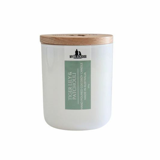 My Black Dog Tiger Lily & Patchouli CocoSoy Candle in a white jar with timber lid
