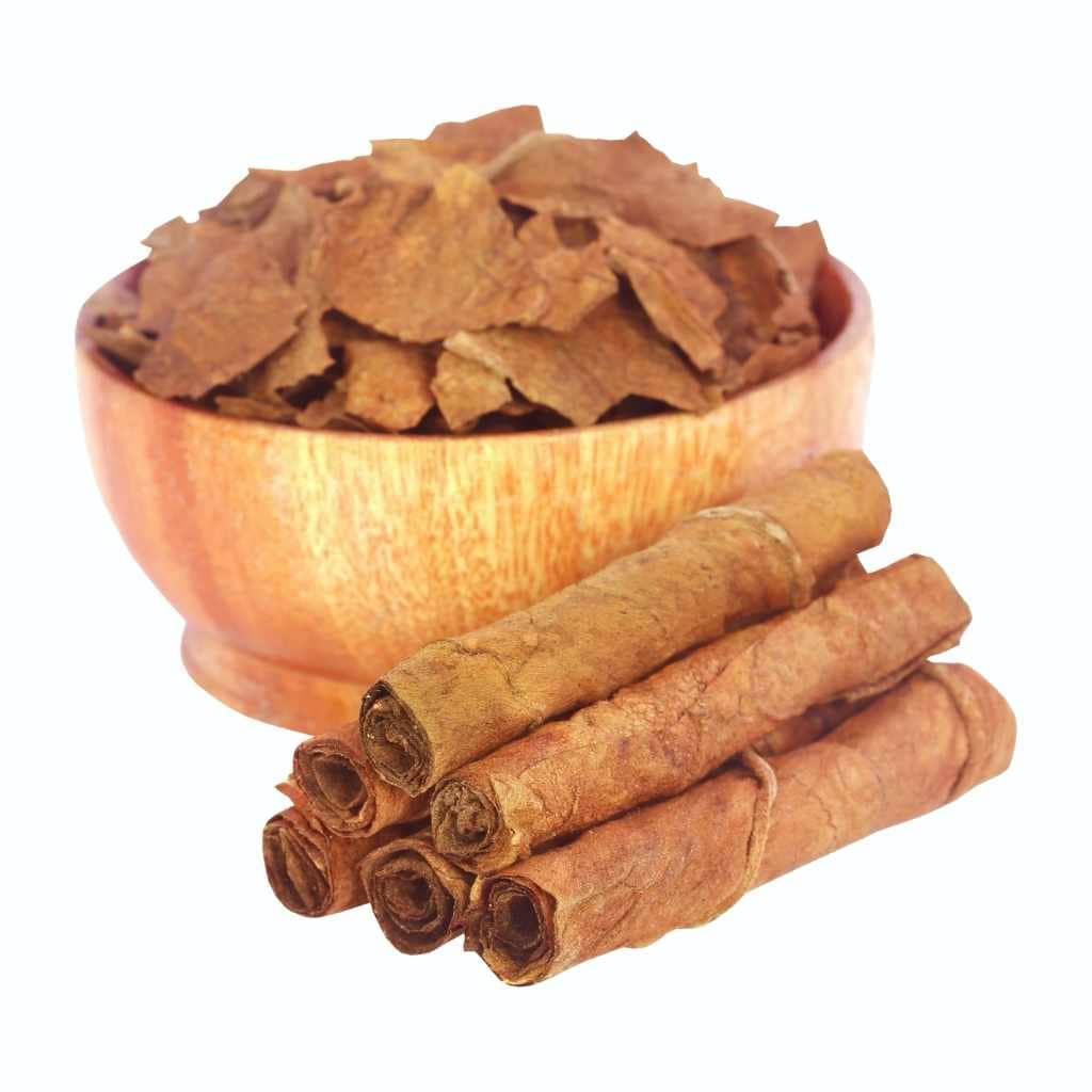 Tobacco leaves in bowl and rolls